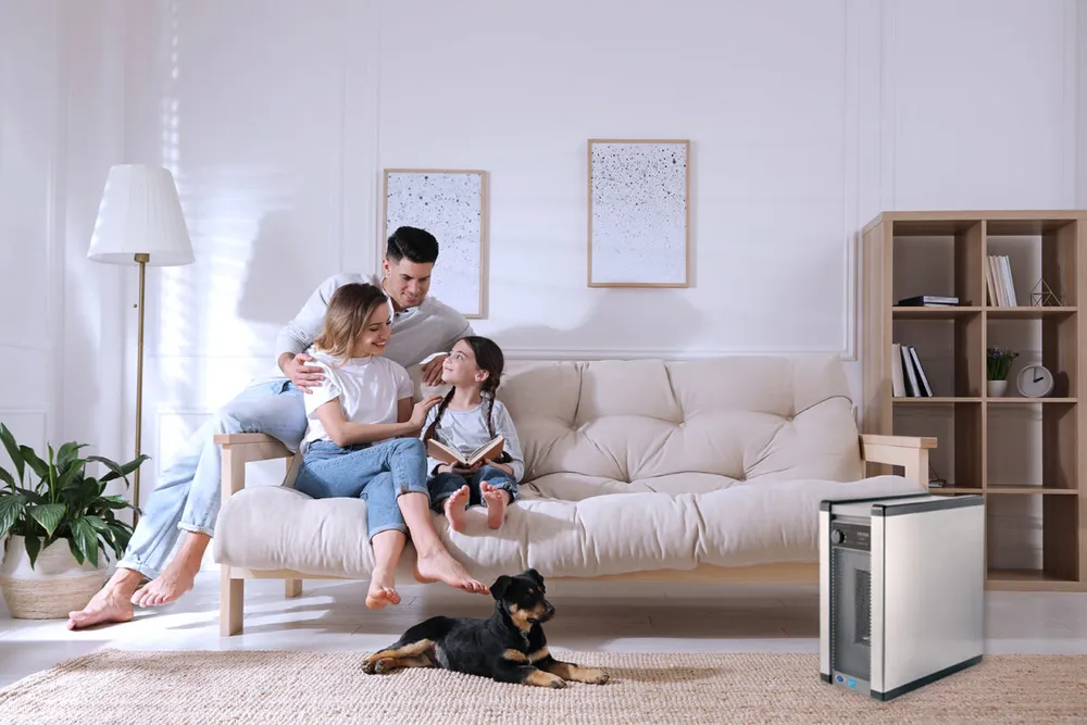 A family on a sofa in a living room with a Nuvia Breeze air purifier beside them